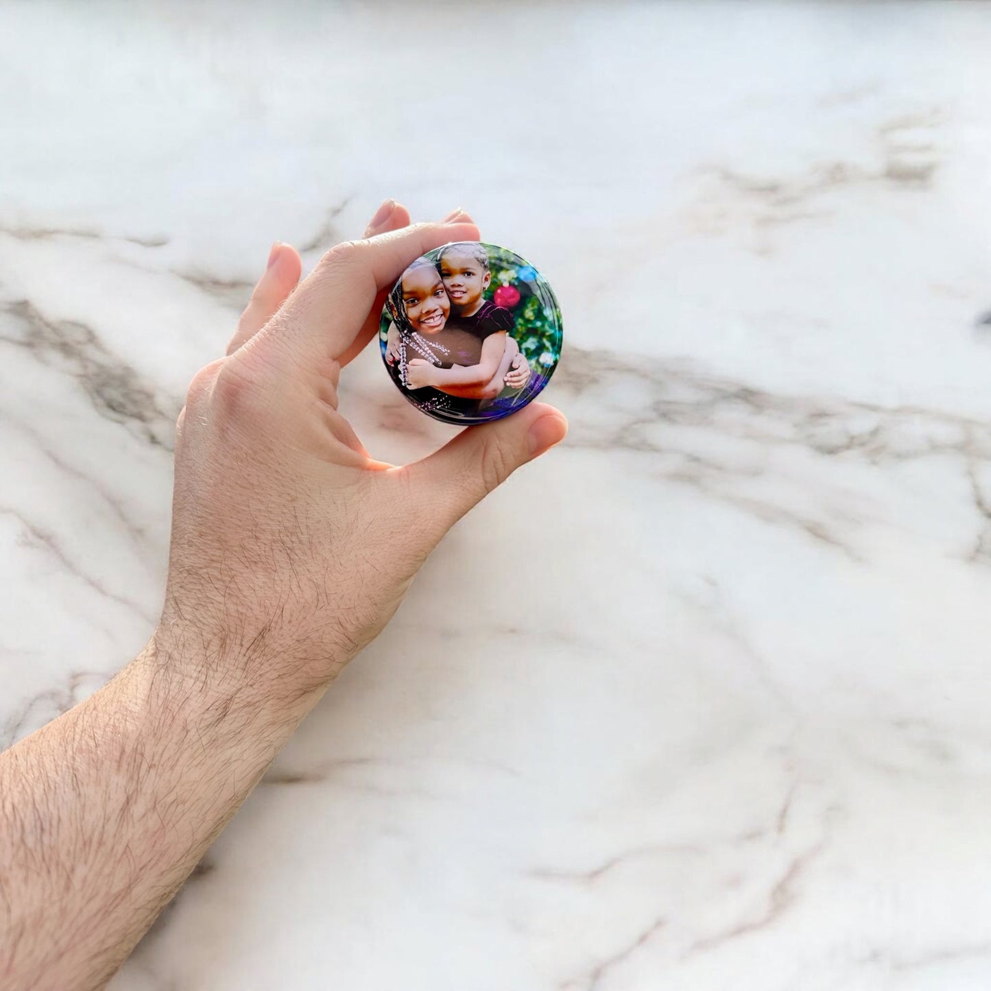 Personalized custom photo magnets displayed on a refrigerator door, featuring various family photos, travel snapshots, and pet pictures, each printed on round magnets with a glossy finish.