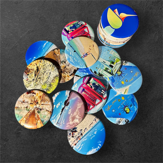 Personalized custom photo magnets featuring vibrant, high-resolution images, neatly arranged on a refrigerator door. Each magnet showcases personal moments like family portraits, travel memories, and pet photos, printed on round glossy, durable surface.